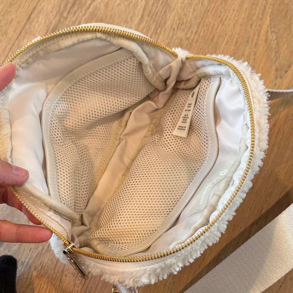 lululemon athletica Cream Sherpa Waist Bag with Gold Hardware